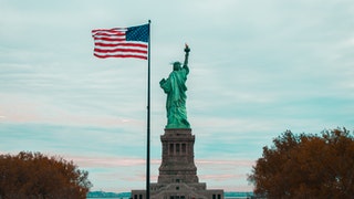 American flag and statue of liberty